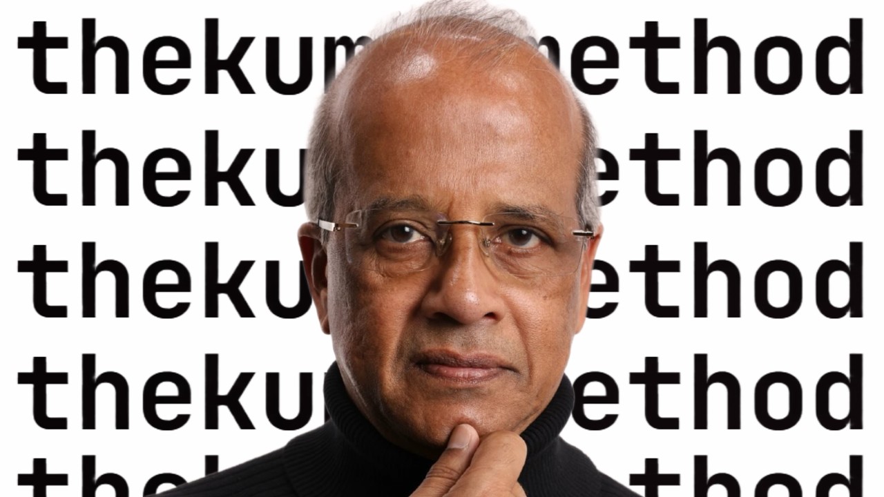 Kumar, the villain-monologue tax guy, staring into the camera in front of a wall of 'thekumarmethod' wordmarks