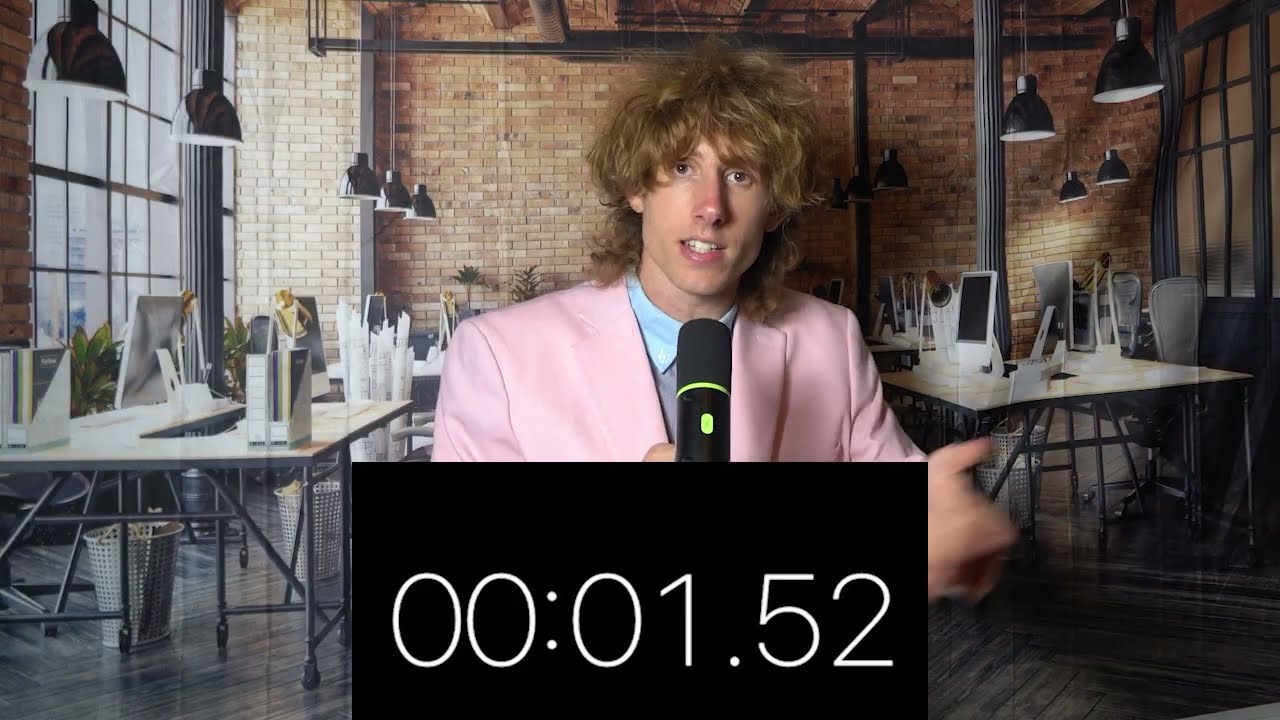 Ben Schneider in a pink suit delivering a parody newsroom segment with a stopwatch graphic